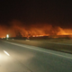 A Controlled fire burns a field in the middle of the night in rural Kansas.